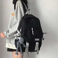 Detail of black multi-functional backpack with a grey plush doll charm and nylon texture - No Pendant / Black