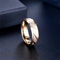 Macro detail of a rose gold titanium steel frosted ring with elegant diagonal patterns. - Size 6 / Rose Gold