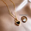 Collier en acier titane doré avec pendentif cœur réversible noir et blanc chic - Collier Cœur Double Face