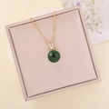 Faceted green glass pendant necklace with V-shaped diamond clasp on gold chain - Green