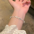 Iridescent beaded bracelet with multifaceted crystal beads worn over lace sleeve - S787 Silver - Light Bulb Silver Nuggets Bracelet