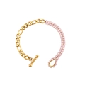 Chique 18K vergulde kettingarmband met roze zirkoon hart en toggle sluiting - Gouden Figaro Schakelarmband Met Dubbele Rij Roze Zirconia