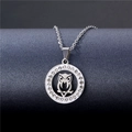 Silver stainless steel owl pendant necklace with rhinestone circle on dark background - NZ17 Owl Hollow
