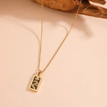 Detail shot of vintage tarot sun necklace with black enamel and sparkling crystals - The Magician (C120)
