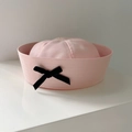 Detailed view of pink sailor brimless hat featuring a delicate black bow decoration - Pink Bowknot