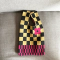 Knit tote bag featuring black and yellow checkerboard pattern with pink flower motif - Yellow Checkerboard
