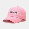 Detail of pink cotton baseball cap with white FOUNDED1986 embroidery patch and curved brim - Adjustable / Pink
