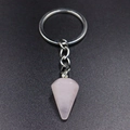 Detailed view of pink rose quartz hexagonal crystal pendant on a silver keychain ring - Rose Quartz