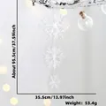Vertical set of three white plastic snowflake ornaments for Christmas window display decor - Large 3D Snowflake