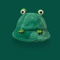 Close-up of plush green frog bucket hat with soft faux fur texture and cute eyes - Green