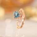 Rose gold heart-shaped ring with light blue topaz stone and small side diamonds - Adjustable Open / Rose Gold