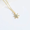 Delicate gold snowflake necklace with blue and white stones on a clean white background - Snowflake (XL3206)