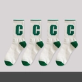 Athletic white and green crew socks featuring a knitted green letter C logo pattern - No.02 Klein Blue Trend Socks