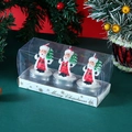 Dettaglio di tre candele a forma di Babbo Natale in confezione regalo Merry Christmas - Babbo Natale con Albero Confezione da 3