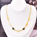 Collier chaîne serpent dorée avec pendentifs papillons en émail noir et blanc - Collier papillon
