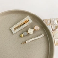 Detail shot of three pearl hair clips with resin and gold accents on a ceramic dish - Style 15 (3-Piece Set/White-Pink Gold Texture)