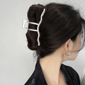 Detailed side view of y2k silver metal hair claw with purple crystals on wavy design - Silver Wave Rhinestone Style (FJ2748)