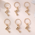 Golden dolphin hair rings set for kids braids featuring six polished alloy pendants - Dolphin Style (YSH3637jingyu) / Set of 6