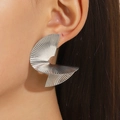 Silver pleated fan-shaped statement earrings featuring bold geometric folds on female model - White Gold Color (5193)