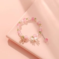 Elegant beaded bracelet with pink and green beads featuring metal bow and white flower charms - S018-pink Bow Lily Of The Valley Bracelet #sz189