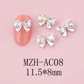 Macro detail of a 11.5x8mm silver bow nail art charm with iridescent rhinestones - Silver Base Moon White (AC08)