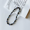 Handmade beaded phone strap with black discs, gold beads, and blue evil eye charms - Black