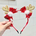 Detail eines Weihnachts-Haarreifs mit goldenen Glitzer-Geweihen und roten Schleifen - Goldenes Geweih Schleife