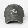 Close-up of white Gigi script embroidery on washed charcoal denim baseball cap - Adjustable / Army Green