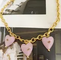 Golden link necklace featuring three pink Murano glass heart pendants with gold glitter - Necklace / Pink