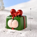 Miniature green resin gift box figurine with red bow and pink accent for Christmas decor - No.12 Green Red Gift Box with Pig Bottom