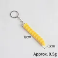 Realistic wavy French fry keychain with golden finish and silver metal ring - Potato Strip - Keychain Style