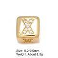 Close-up of golden letter X spacer bead with micro-pave cubic zirconia for DIY jewelry - Letter X
