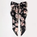 Oversized black bow hair clip featuring a delicate pink floral rose pattern on chiffon fabric - Black Floral