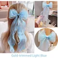 Light blue organza hair bow with gold edges and long ribbon streamer for girls - Princess Blue With Gold Edge