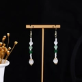 Detail of long drop tassel earrings with white and green beads on a golden T-stand - E4759-2 (Gold Multi-color Stacked Beads)