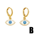 Golden Evil Eye drop earrings with blue enamel and sparkling crystals on white background - Round Evil Eye Style (B)