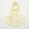 Detail view of cream slub cotton scarf showing breathable texture and fringe edges - Light Yellow/Cream