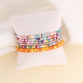 Bohemian multilayer seed bead bracelet set displayed on a white velvet cushion - 2#Mixed Orange