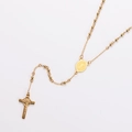 Detailed view of a gold stainless steel beaded necklace with a crucifix and medal - Style 6