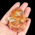 Hamsa Hand natural stone pendant carved with orange and yellow striped agate textures - Crazy Agate