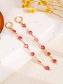 Elegant gold drop earrings featuring a series of vibrant red round gemstones - Pink Round Earrings (7056)