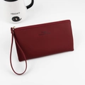 Long burgundy zip-around clutch wallet in PU leather with gold hardware and wrist strap - Burgundy