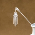 Detail of silver geometric hollow hairpin with flower relief and tassel pendant - Exquisite Floral Multi-Tassel (F379)