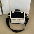 Minimalist black and white canvas mommy bag with adjustable shoulder strap and pockets - Black