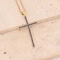Close-up of golden cross pendant featuring pavé set deep blue gemstones on stone background - Royal Blue (5#Royal Blue)