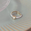 Pink enamel butterfly ring in gold finish with heart-shaped gemstone on ceramic plate - Pink Base Heart Diamond