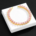 Close-up of gold tennis chain necklace with pink heart-shaped stones on jewelry box - 10 inch (25cm) / Gold Anklet (Pink Zircon)