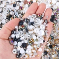 Close-up of mixed sizes resin pearls and rhinestones for DIY nail art and phone cases - Half-round Pearl Silver White Black Ab Series - F / 30 g
