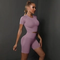 Detailed texture of seamless light purple yoga set featuring a crop top and high waist shorts - Light Purple