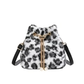 Stylish black and white leopard print plush bucket bag with golden chain and pearl charms - Off White